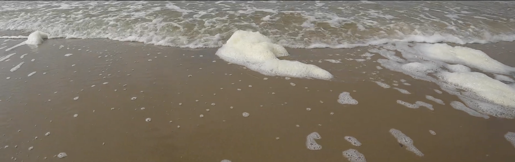 Zand met zeeschuim